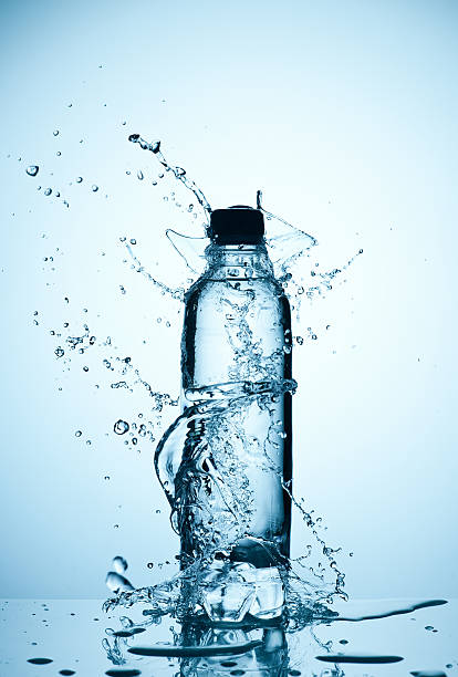 Water splashed around a plastic bottle of CPAP distilled water