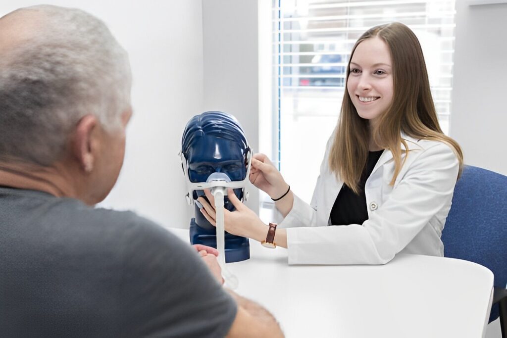 A picture of a patient consulting with a doctor about choosing the right CPAP mask for him