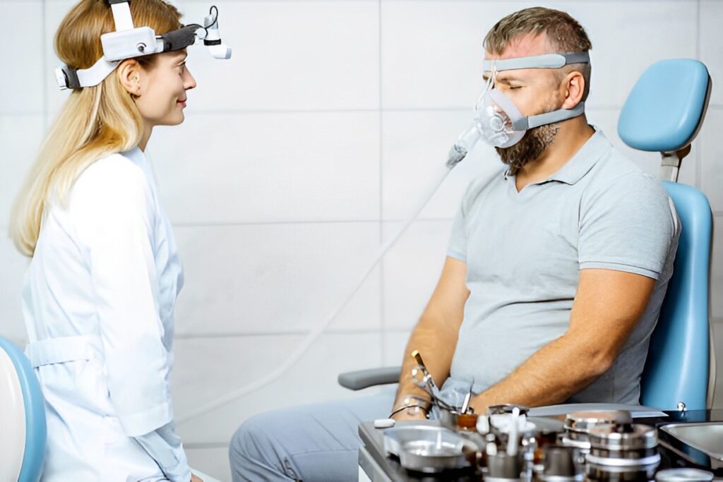 A picture of a doctor and a CPAP patient.