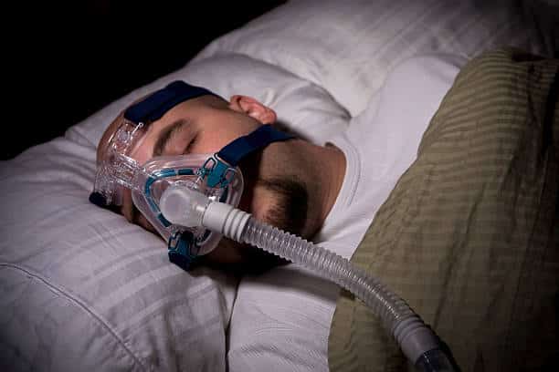A picture of a man having a CPAP therapy