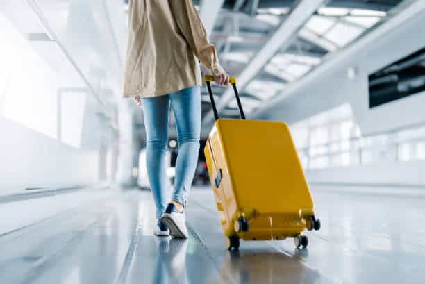 A picture of a girl with her luggage