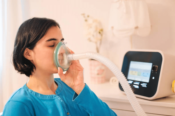 A photo of a woman having CPAP therapy