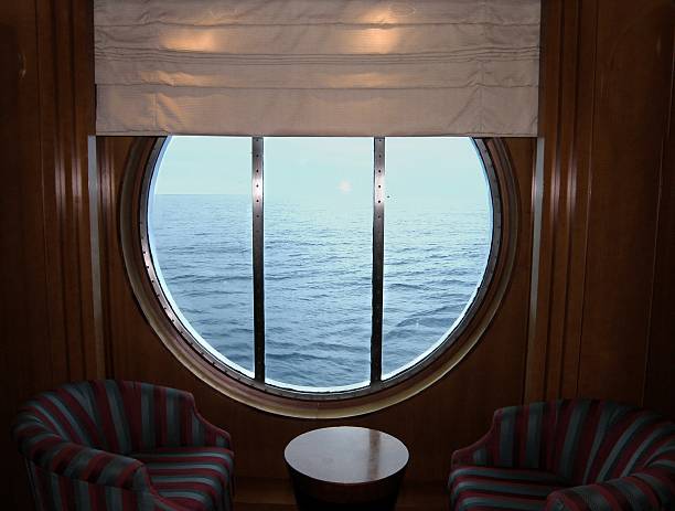 A porthole in a lounge on a cruise ship - cabin steward