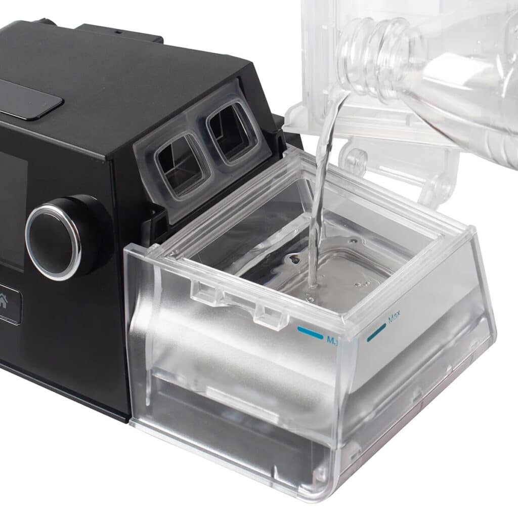 A CPAP machine with a water chamber attached to it
