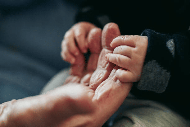 A Hand of Children and the Elderly
